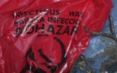 biohazard-infection-waste-bag-placed-in-yard-picked-up-and-put-in-trash-barrel-before-read-label